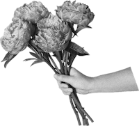 a black and white photo of a hand holding a bunch of flowers